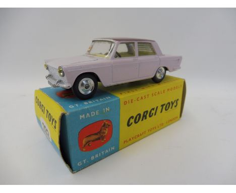 A boxed Corgi Toys no. 232 Fiat 2100 in two tone in lilac, with mauve club leaflet.