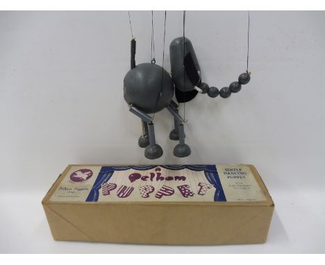 A boxed 1950s Pelham Puppet - Elephant, with original stringing and controller, no instructions.