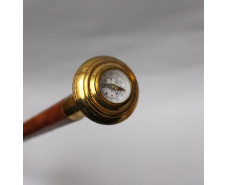 Walking stick with compass , bronze , polished on cherrywood 20 th Century. 91 cm long  
