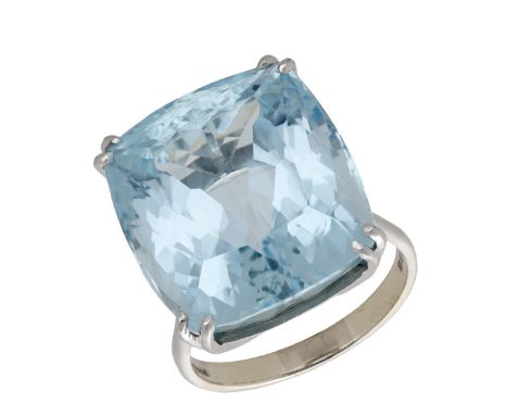 An aquamarine dress ring, 1974, the cushion-shaped aquamarine claw-set to a plain polished 18ct gold band, London hallmark, r