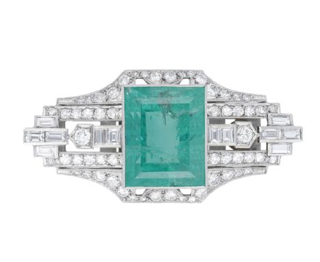 An emerald and diamond obi sash clasp by Mikimoto, circa 1950, the rectangular step-cut emerald collet-set within a pierced a