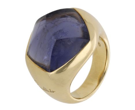 An iolite ring by Pomellato, the fancy-shaped iolite in a tapering mount, signed, Italian assay mark, stamped ‘750’, ring siz
