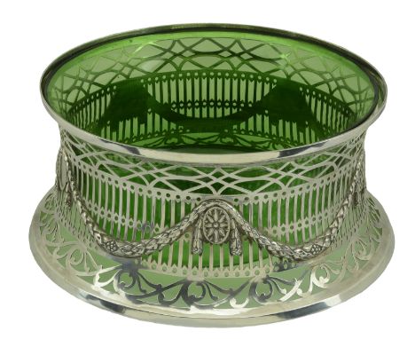A distinctive and unusual George V silver centrepiece, in the form of an outsize Irish dish ring, the pierced frame applied w