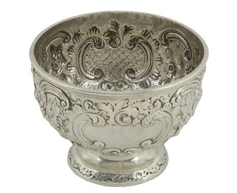 A Victoria silver sugar basin, repoussé decorated in high relief with flowerheads, C-scrolls and leaves on a pounced ground, 