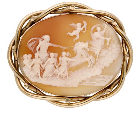 A late 19th century shell cameo brooch, oval, carved to depict Aurora (Dawn) leading Apollo, God of the Sun, his golden chari