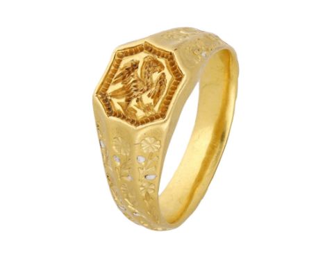 A late 15th century gold seal ring, the raised octagonal bezel engraved with an eagle rising with wings displayed and inverte