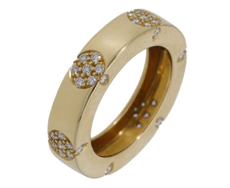 A diamond ring, the polished band set with circular clusters of brilliant-cut diamonds, with similarly-cut diamond accents to