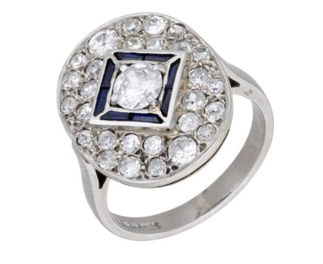 An 18ct white gold and diamond panel ring, of early 20th century design, the oval panel pavé-set with circular-cut diamonds, 
