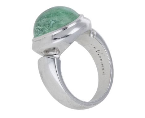 A ‘Paraiba’ tourmaline dress ring by Leo de Vroomen, 2010, the oval tourmaline cabochon in a rubover setting, mounted in 18ct