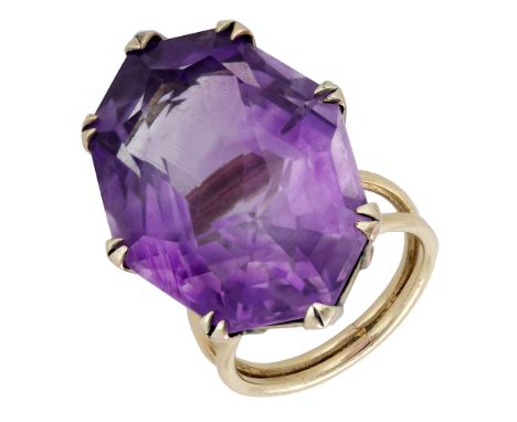 An amethyst dress ring, the large octagonal mixed-cut amethyst claw-set to a bifurcated band, ring size H.  £260-£360  ---  C