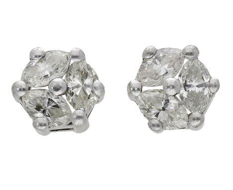 A pair of diamond ear studs, each set with a trio of marquise-cut diamonds, total diamond weight approximately 1.25 carats.  