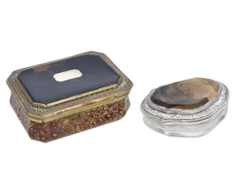 An 18th century silver mounted agate snuff box, of cartouche form, the shaped agate panel within floral engraved rocaille bor