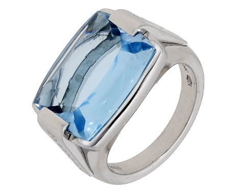 A blue topaz ring by Bulgari, the cushion-shaped buff-top blue topaz between tapering shoulders signed ‘BVLGARI’, Italian ass