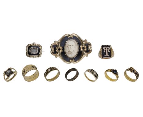 A collection of antique memorial jewellery, comprising two brooches and eight rings, the majority with black enamel decoratio