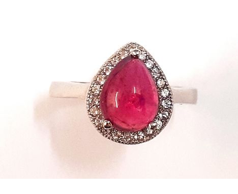 A 925 silver cluster ring set with a pear cabochon cut ruby surrounded by white stones, (L).