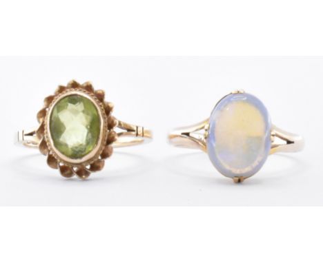 Two 9ct gold rings to include a 9ct gold and opal ring being set with an oval opal cabochon with split shoulders. The other b