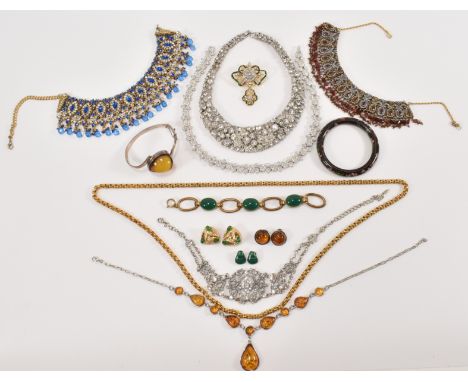 A collection of vintage costume and fashion jewellery to include three collar necklaces being set with coloured stones, a whi