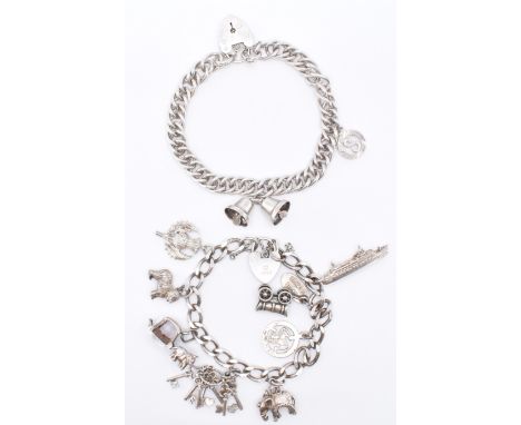 Two silver charm bracelets to include a hallmarked vintage example with eight silver charms and a double link bracelet with t