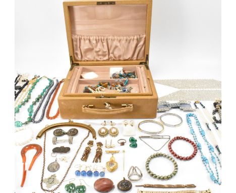 A collection of vintage costume jewellery housed within a leather jewellery box to include a an orange glass beaded necklace,