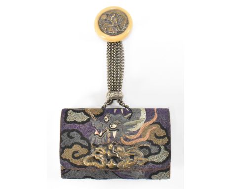 A vintage 1940's Japanese purse and inro. The purse being embroidered throughout with a dragon, having a cast metal dragon fo