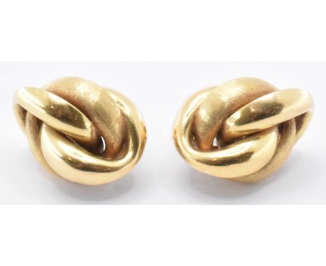 A pair of vintage gold knot earrings having hinged backs and curved posts. Unmarked but tests indicate 9 and 18ct gold. Weigh