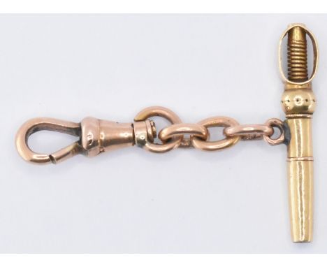 A French 18ct rose gold fob with attached yellow gold pocket watch key. &nbsp;The dog lead clasp fob having French eagle assa