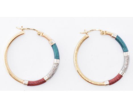 A pair of 9ct gold and enamel hoop earrings. The earrings being set in red, green and silver enamel to half of the hoop and 9