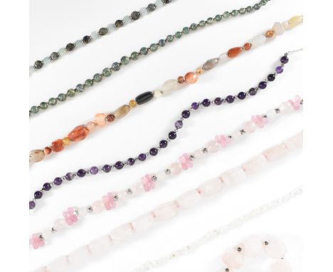 A collection of gemstone necklaces to include rose quartz, amethyst, moss agate, moonstone, a rose quartz bracelet, and a qua