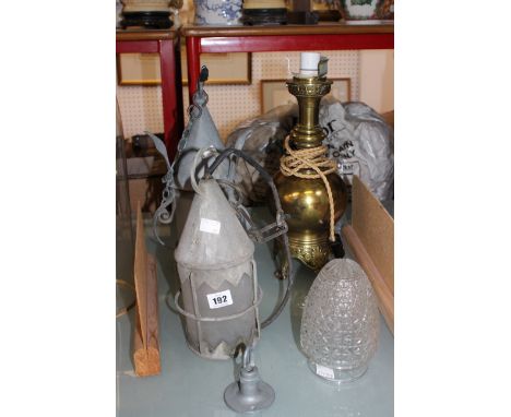 A standard lamp (sold as parts), a glass shade and two lanterns