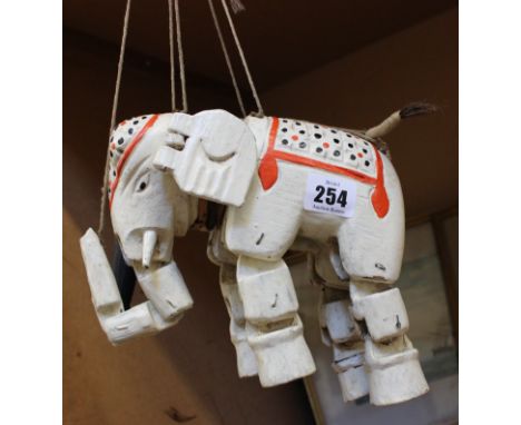 A wooden puppet of an elephant 