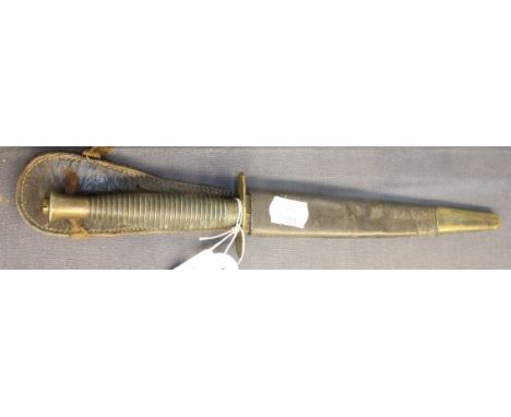 A Fairbairn Skyes Commando Knife and scabbard. 29cm
