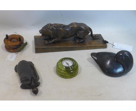 A miscellaneous collection of items to include an antique carving of a lion, antique carving of a tortoise, stone carving of 