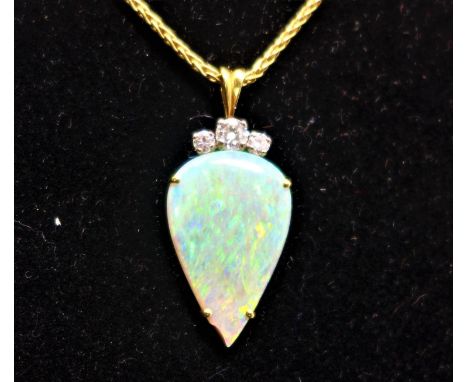 An 18ct yellow gold, opal and diamond set pendent with matching earrings 