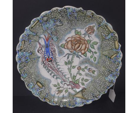 A Turkish ceramic charger with floral design, signed, H.7 D.38cm 