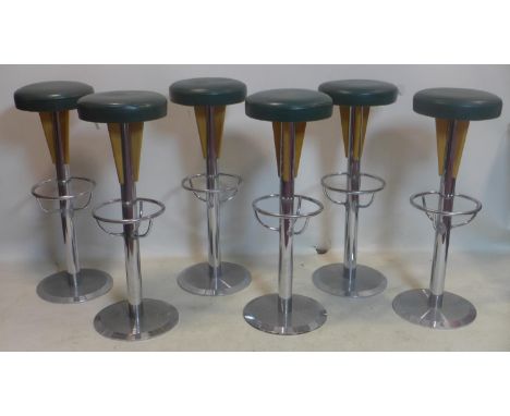 A set of six vintage heavy chrome bar stools with green leather seats 