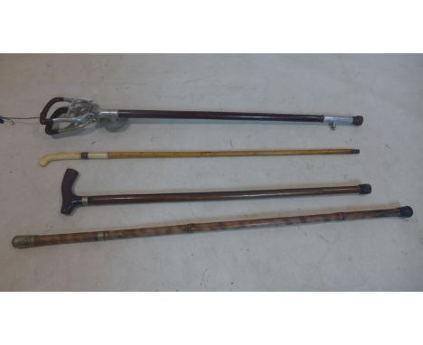 A collection of 4 sticks to include a 19th century example with ivory handle, a vintage mills munitions shooting stick, a mil