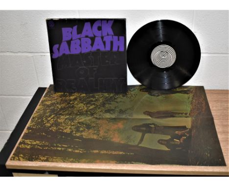A Vertigo press of Black Sabbath's Masters of Reality - UK press with the exceptionally hard to find poster - album is VG+ - 