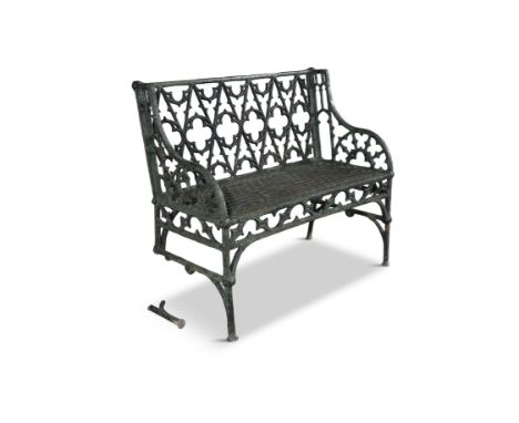 A VICTORIAN GREEN PAINTED GOTHIC CAST IRON TWO-SEATER GARDEN BENCH,  with open tracery back and honeycomb seat (three legs da