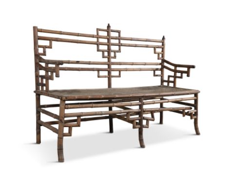 A 'SANGLIER &amp; LESPINE' BAMBOO AND CANEWORK LONG BENCH,  with a metal plaque 'Sanglier &amp; Lespine, Successeur Destival 