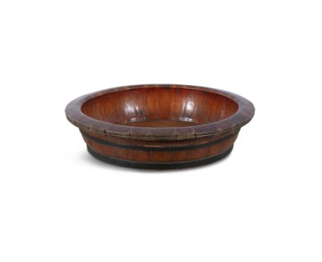 A STAINED WOOD AND METAL BOUND SHALLOW BASIN.   74cm diameter, 17.5cm high