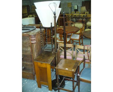 A 1920's Oak hinged sewing table, an oak stick stand, shoe rack and 2 lamp standards.(5)