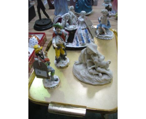 A Continental group figures around a chess board, a continental cherub figural candlestick , a Parian ware model of a young b