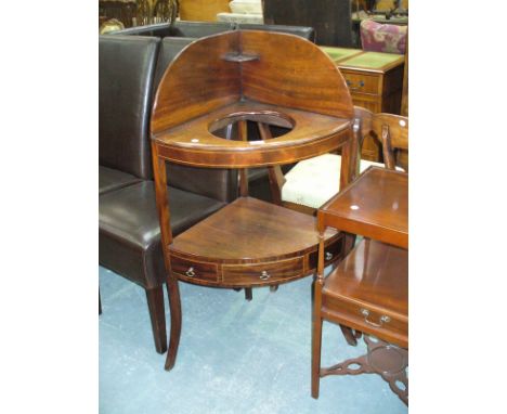 A 19th Century inlaid mahogany corner washstand , the lower shelf with 3 frieze drawers, rasied on outswept feet. 