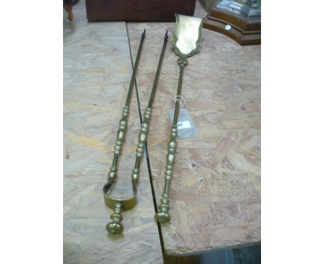 2 Brass fire irons with button finials.