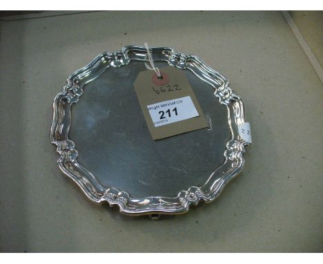 A Small silver shaped circular salver raised on 4 scroll feet, Sheffield  ( 5.5 ozs )