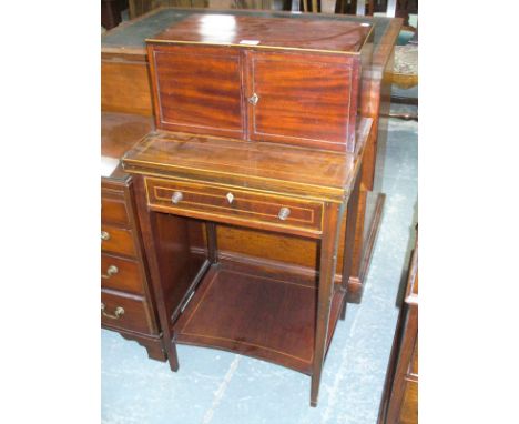 An Edwardian inlaid mahogany bonheur de jour , the raised back with two cupboard doors enclosing an arrangement of five drawe