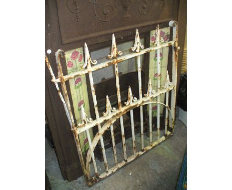 A Painted iron garden gate.