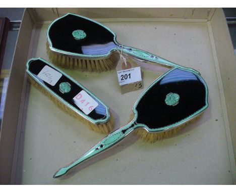 A pair of Art Deco guilloche enamel and silver mounted brushes
Each finely enamelled in mint green with a carved apple green 