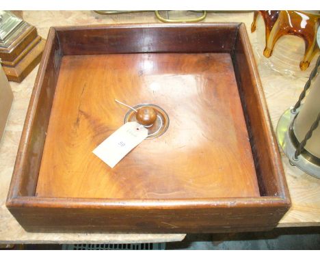 A Victorian mahogany book press with a button handle.