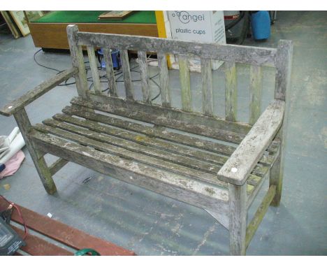 A Hardwood slatted  garden bench.